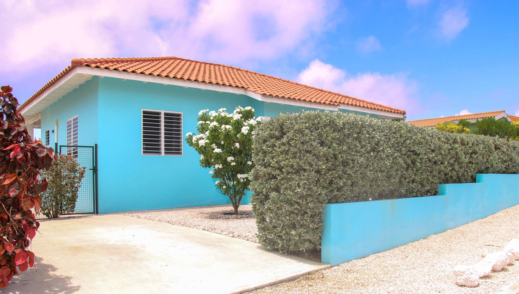 Private driveway beside the villa with the gate to the garden