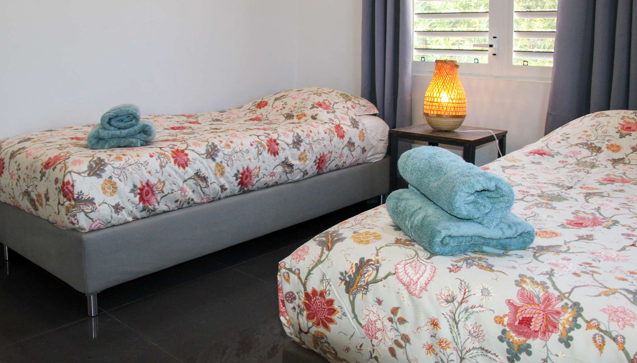 Second bedroom with two single beds and fresh towels
