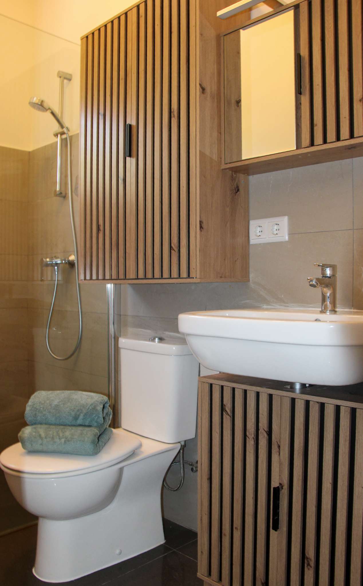 Second bathroom with oak mirror cabinet and walk-in shower